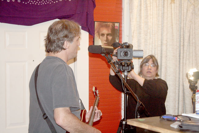 Oxford Sounds Producer Marie Antoon films George McConnell playing live in Black Wings Studio near Water Valley, Mississippi. Photograph by Newt Rayburn.
