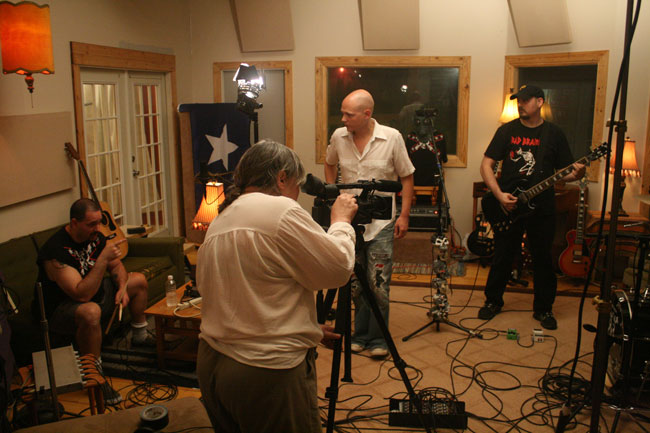 "Oxford Sounds" Producer Marie Antoon films a scene with The Cooters and music Producer Winn McElroy at Black Wings Studio near Water Valley, Mississippi. Photograph by Newt Rayburn.