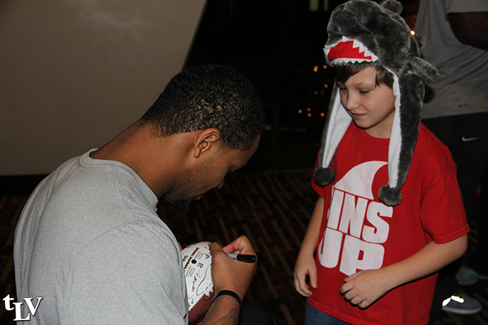issac signs autograph