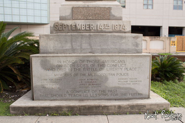 The Battle of Liberty Place monument in New Orleans, Louisiana, January 2, 2016. Photograph © 2016 Newt Rayburn - newtrayburn@gmail.com. Inscription reads "IN HONOR OF THOSE AMERICANS ON BOTH SIDES OF THE CONFLICT WHO DIED IN THE BATTLE OF LIBERTY PLACE. MEMBERS OF THE METROPOLITAN POLICE (Eleven names of individual officers who died) A CONFLICT OF THE PAST THAT SHOULD TEACH US LESSONS FOR THE FUTURE"
