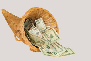Cornucopia,Overflowing,With,U.s.,Twenty,Dollar,Bills,With,A,Shallow