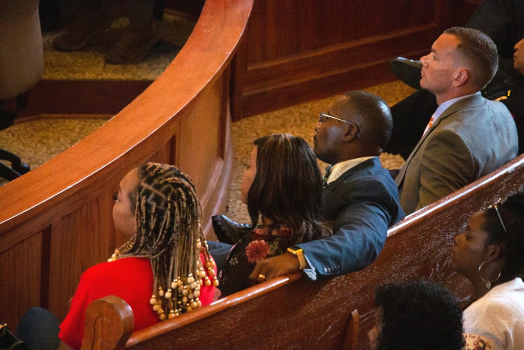 The family of Jimmie “Jay” Lee looked on in court as the bond hearing and preliminary trial of the man accused of killing him unfolded in the Lafayette County Courthouse on Tuesday, Aug. 9, 2022. Lee’s parents, Jimmie and Stephanie Lee, and sister, left, sat beside Oxford Police Department Police Chief Jeff McCutchen, right, in the front row of the courtroom. Photo by Grace Marion